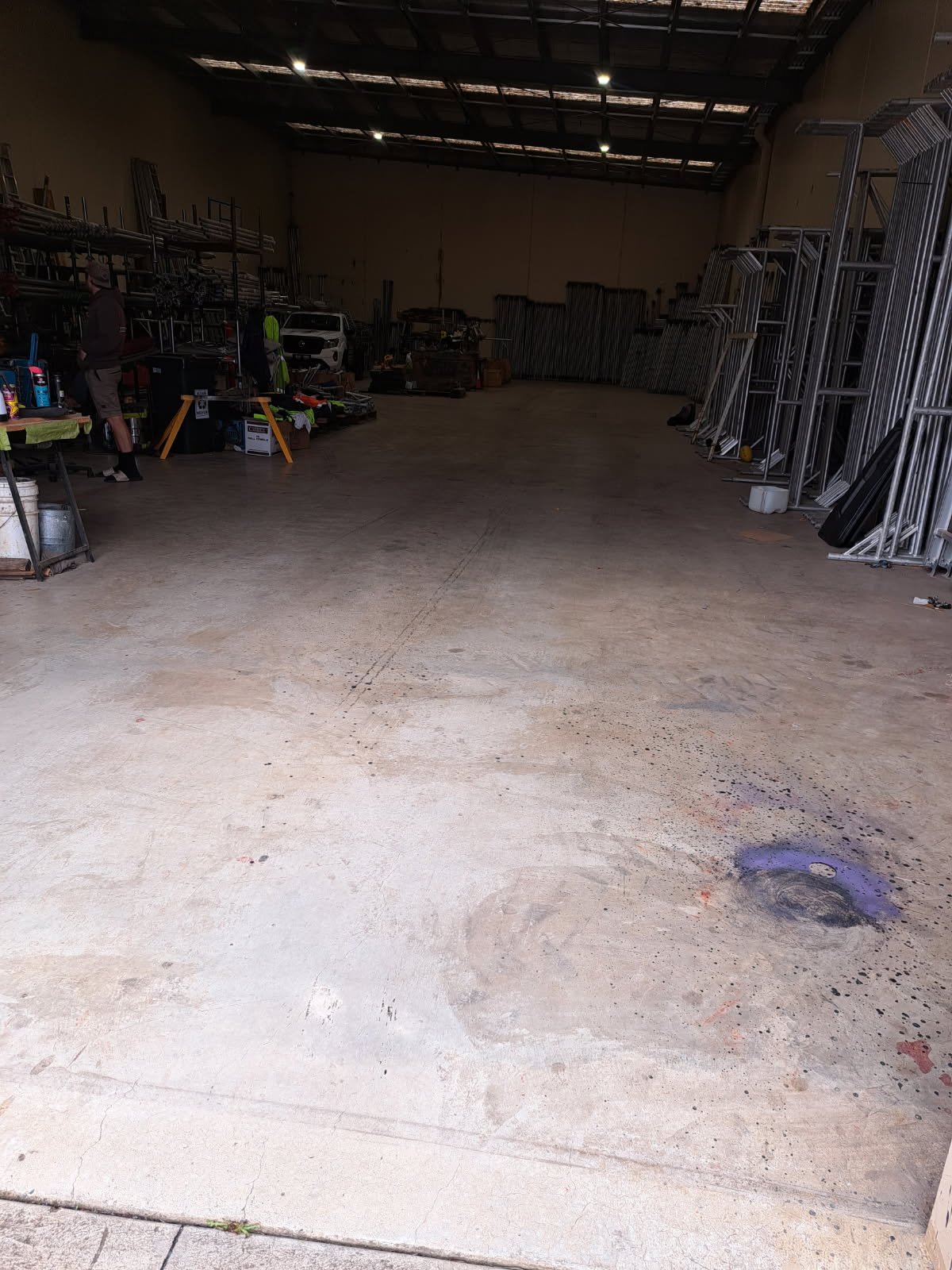 Dark factory interior with degraded polycarbonate roof